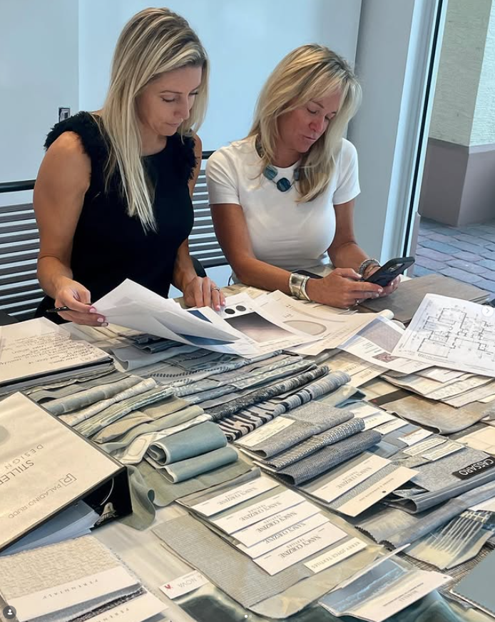 Allison Paladino and Zita Rudd review swatches and plans for a Palm Beach Interior Design and construction project.
